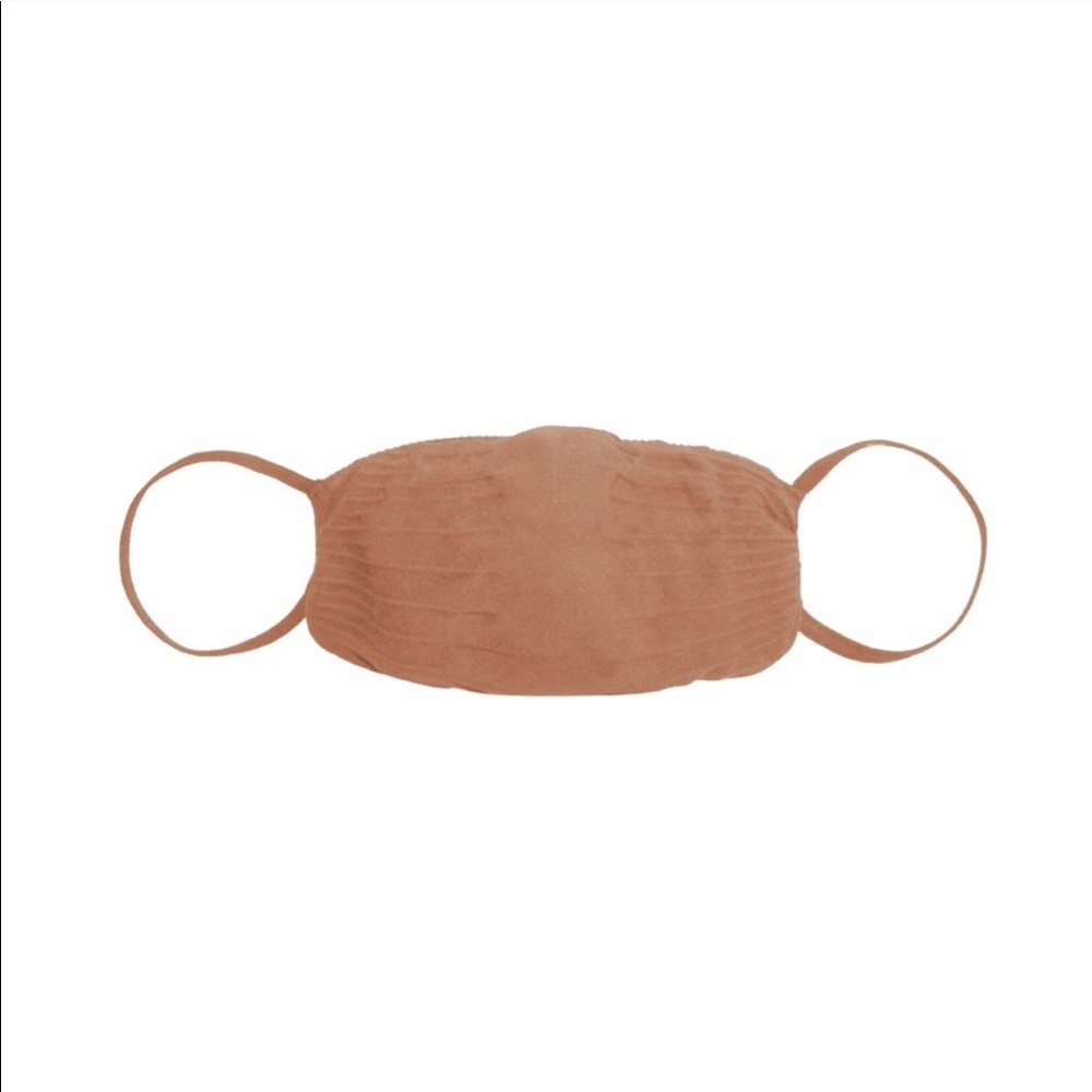 SKIMS seamless face mask in the color SIENNA